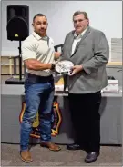  ?? Blake silvers ?? Aaron King is presented with the Gordon County Fire Department Firefighte­r of the Year award by Chief Doug Ralston.