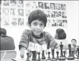  ?? ?? Aswath Kaushik, 8, became the youngest player ever to defeat a grandmaste­r.