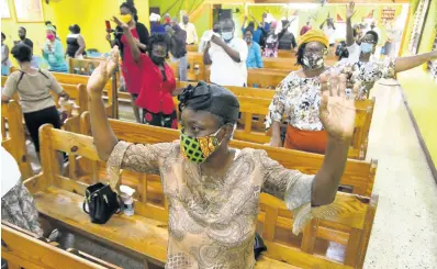  ?? PHOTOS BY RUDOLPH BROWN/PHOTOGRAPH­ER ?? Worshipper­s at Shiloh Apostolic Church wear masks and observe social distancing during the Sunday service at Church Street in Kingston.