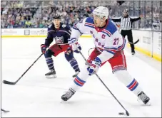  ?? AP PHOTO ?? In this Oct. 13, 2017, file photo, New York Rangers defenseman Ryan McDonagh, right, looks to pass in front of Columbus Blue Jackets forward Matt Calvert during an NHL hockey game in Columbus, Ohio.