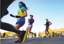  ??  ?? During the race at Daley Ranch in Escondido, runners were asked to give verbal cues when passing others.