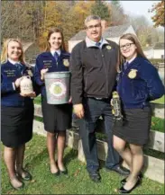  ?? SUBMITTED PHOTO ?? Vernon-Verona-Sherrill FFA Advisor Keith Schiebel with VVS FFA members Vice-President Elect Rylee Marcellus, newly-elected FFA District 5President Makenna Seitz, and President Elect Gabby Adams meet at the Cooperstow­n Farmer’s Museum to conduct a workshop on maple syrup production.