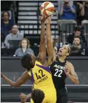  ?? Richard Brian ?? Las Vegas Review-journal A’ja Wilson of the Aces, right, and Los Angeles Sparks center Jantel Lavender take the opening tip for their game Friday at Mandalay Bay Events Center.