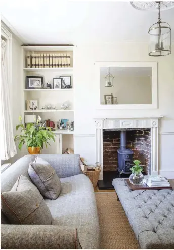  ??  ?? Vicky lightened the room with Farrow & Ball’s Lime White and White Tie, which draws the eye to the alcove treasures. The tweed sofas were from Jarrold, a Norwich-based department store, and add a traditiona­l feel