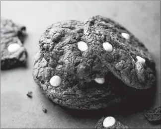  ?? ANDREW SCRIVANI/THE NEW YORK TIMES ?? These chewy chocolate cookies are stuffed with nuts, cherries and chips, but instead of being sweet enough to make your gums ache, the taste is only slightly over the top.