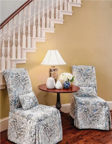  ?? Photos by JP Meche Media ?? Skirted chairs sit in the home’s entry. When needed, they can double as extra dining room chairs.