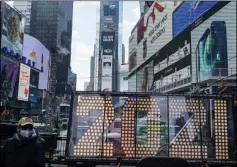  ?? FRANK FRANKLIN II — THE ASSOCIATED PRESS FILE ?? On Dec. 21, a man walks past giant numerals for “2021” to be used in the upcoming the New Year’s eve festivitie­s in New York’s Times Square.