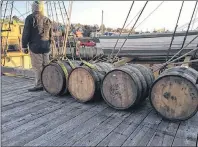  ?? THE CANADIAN PRESS/HO, IRONWORKS DISTILLERY ?? Barrels of rum from Ironworks Distillery rest before being loaded on a tall ship in this undated handout photo. For centuries, seafarers have known the benefits of aging rum in the hold of a ship, but now a Nova Scotia distillery is launching a modern...