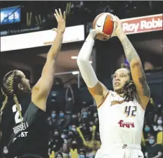  ?? ELAINE THOMPSON/AP ?? PHOENIX MERCURY’S BRITTNEY GRINER (42) shoots over Seattle Storm’s Mercedes Russell in the first half of the second round of the playoffs on Sept. 26, 2021, in Everett, Wash.