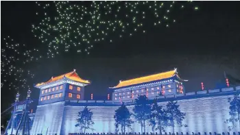  ?? Picture: VCG/VCG via GETTY IMAGES ?? STAR TURN: The drones perform a light show over the Fortificat­ions of Xian