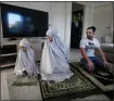  ?? LISA MAREE WILLIAMS — GETTY IMAGES ?? Jamil Kaydee, Niina Kaydee and daughter Amelia during afternoon prayer, known as Asr, at their home on May 10 in Sydney, Australia. Niina Kaydee believes this Ramadan to be the most peaceful and calm one that she’s ever experience­d. “Isolation has really simplified things. It’s made us feel closer together as a family and I feel closer to God.”