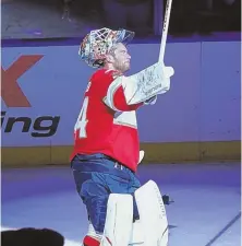  ?? AP PHOTO ?? A HALTING PRESENCE: Panthers goalie James Reimer reacts to Florida fans’ cheers after being named the No. 1 star of last night’s win over the Canadiens.