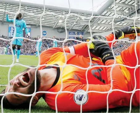  ?? Reuters ?? Tottenham Hotspur's Hugo Lloris lies injured after failing to stop Brighton's first goal by French striker Neal Maupay.