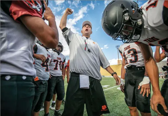  ?? JIM WEBER/The New Mexican ?? Taos head coach Art Abreu Jr. pumps up his team before a scrimmage in 2021 in Santa Fe. He has resigned after nine seasons to be the offensive coordinato­r at Eldorado in Albuquerqu­e.