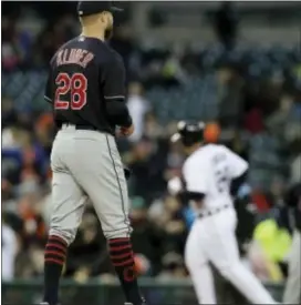  ?? CARLOS OSORIO — THE ASSOCIATED PRESS ?? Cleveland pitcher Corey Kluber stands on the mound as Detroit’s Cabrera rounds the bases after homering Tuesday in Detroit. Miguel