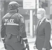  ?? CAROLYN KASTER/AP 2020 ?? GOP leaders say they are opposed to President Biden’s $1.9 trillion plan. Above, Biden, then a presidenti­al candidate, talks to an officer Oct. 19 in Delaware.