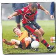  ?? Picture: Andy Jones FM4624006 ?? Castle Colts’s Dan Cordice (red) gets away from Larkfield Green
