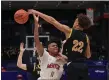  ?? TIM PHILLIS — FOR THE NEWS-HERALD ?? Mentor’s Steven Key has a shot blocked by Centervill­e’s Tre Johnson on March 20 during a Division I state semifinal in Dayton.