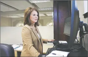  ?? (NWA Democrat-Gazette/Thomas Saccente) ?? Anita Brackin, vice president of workforce developmen­t for the Fort Smith Regional Chamber of Commerce, works in her office at the chamber July 12.