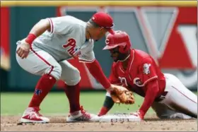  ?? JOHN MINCHILLO — THE ASSOCIATED PRESS ?? Cincinnati Reds’ Phillip Ervin, right, slides into second against Philadelph­ia Phillies second baseman Asdrubal Cabrera on a double off starting pitcher Zach Eflin in the third inning of a baseball game, Sunday.