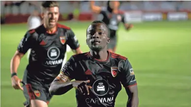  ?? PATRICK BREEN/THE REPUBLIC ?? Phoenix Rising's Solomon Asante reacts after scoring a goal against the Oakland Roots during a game at Phoenix Rising FC Stadium on May 8.