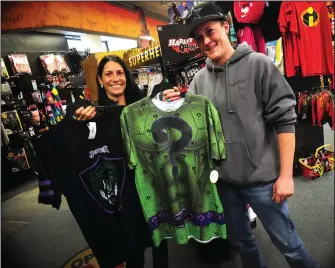  ?? Call photos Ernest A. Brown ?? Meghan Punsalan, left, and Desiree Plante, both of Voluntown, Conn., choose their Halloween costumes before meeting friends in Woonsocket for a pre-Halloween get-together at Spirit Halloween at the Park Square, Woonsocket location Friday evening. They went with the Superhero villain costumes from the Batman series.