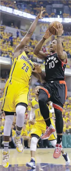  ?? MICHAEL CONROY/THE ASSOCIATED PRESS ?? Raptors guard DeMar DeRozan shoots over Indiana Pacers centre Ian Mahinmi in Game 3 of their playoff series in Indianapol­is, Thursday. DeRozan finished with 21 points.