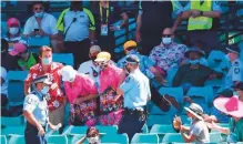  ?? Reuters ?? Police remove a group of spectators fromtheir seats after ■ Mohammad Siraj of India complained to umpires of being racially abused during the third Test against Australia.