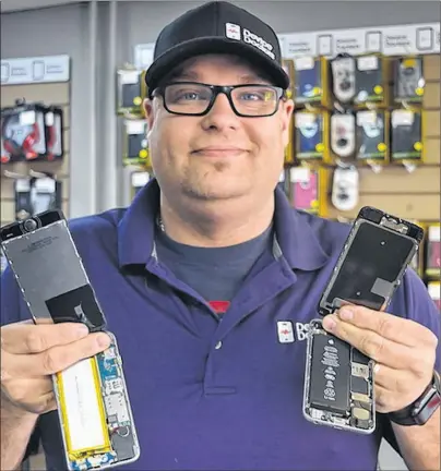  ?? DAVE STEWART/THE GUARDIAN ?? Cory Rusk, owner/operator of Device Doctors in Charlottet­own, says they’ve seen a lot of fake iPhones lately and wants to issue a warning to the public. The fake phones are virtually identical to the real thing. One of the only ways to tell is to take...
