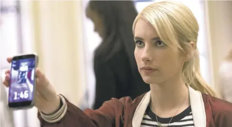  ?? LIONSGATE ?? A normally reserved teen (Emma Roberts) gets drawn into risky behavior when she joins a popular internet game in “Nerve.”