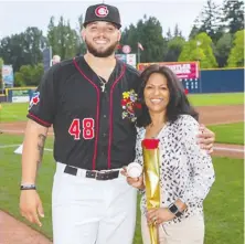  ?? USHA TKACHYK ?? Vancouver's Usha Tkachyk stands with her young billet, Vancouver Canadians pitcher Alek Manoah, in late summer 2019. Tkachyk sent the newest Blue Jay a text after his big-league debut.