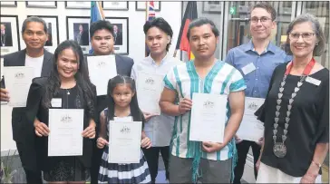  ?? Picture: PAUL CARRACHER ?? HARMONY CELEBRATIO­N: New Australian citizens, from left, Vilarbie Vence, Cecile Vence, Kim Vence, Stacy Vence, Shaun Vence, Klo Lwe Moo Doh Soe, Daniel Laing and Horsham mayor Robyn Gulline.