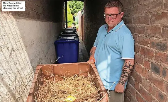  ?? ?? Mick Dunne filled his wheelie bin cleaning the street