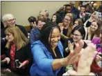  ?? ASSOCIATED PRESS ?? Delaware County Council candidate Monica Taylor highfives a supporter during the Delaware County Democratic Committee’s election watch party at the Inn at Swarthmore in Swarthmore.