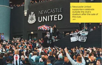  ?? AFP ?? Newcastle United ■ supporters celebrate outside the club’s stadium after the sale of the club.