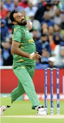  ??  ?? Pakistan's Wahab Riaz bowls during the ICC Champions Trophy match between India and Pakistan at Edgbaston in Birmingham, England, on Sunday. (AP)