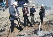  ??  ?? From left, Wayne Farey of Campbell Constructi­on, Victoria Mayor Lisa Helps, David Chard of Chard Developmen­t and architect Gerda Geldenhuys break ground for the Escher condominiu­m developmen­t on April 22, 2015.