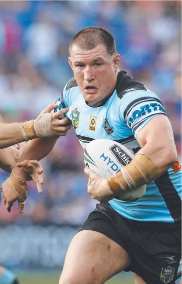  ?? Picture: AAP IMAGE ?? NO COMPLAINTS: Paul Gallen of the Sharks busts through the tackle of Jack Cogger during the Round 26 match against the Newcastle Knights.