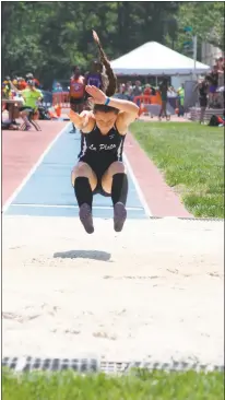 ??  ?? La Plata’s Lillian Reese flies through the air on her way to winning the 2A state long jump competitio­n with a distance of 18 feet 8 inches, 1 1/2 inches off the 2A meet record, at the state track and field championsh­ips Saturday at Morgan State...