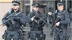  ?? Pictures: FACUNDO ARRIZABALA­GA/EPA & VICTORIA JONES/PA ?? Armed police units are more visible in London, but resources are stretched