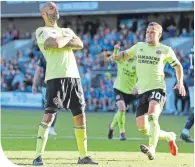  ??  ?? David McGoldrick celebrates Sheffield United’s second at Millwall