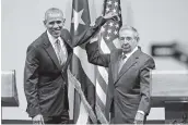  ?? AL DIAZ adiaz@miamiheral­d.com ?? In March 2016, President Obama stood with Cuban leader Raúl Castro at the start of a thawing of relations.