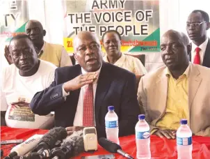  ?? -Picture by Innocent Makawa ?? War Veterans national chairman Cde Christophe­r Mutsvangwa addresses a press conference while flanked by secretary-general Cde Victor Matemadand­a (left) and spokeperso­n Cde Douglas Mahiya (right) in Harare yesterday.