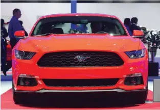  ?? — AFP ?? In this file photo taken on November 19, 2014, the new Ford Mustang is displayed at the LA Auto Show’s press and trade day in Los Angeles, California.