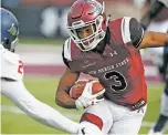  ?? ANDRES LEIGHTON/THE ASSOCIATED PRESS ?? New Mexico State running back Larry Rose III, right, carries against South Alabama during Saturday’s game in Las Cruces. The win makes the Aggies eligible for their first bowl since 1960.