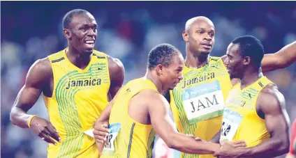  ?? AP FOTO ?? Usain Bolt ( far left) will lose one of his Olympic gold medal after Nesta Carter (right) tested positive in a re-test of 2008 samples. FROM NINE TO EIGHT.