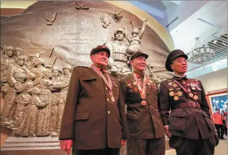  ?? HOU YU / CHINA NEWS SERVICE ?? Veterans attend an exhibition marking the 70th anniversar­y of the Chinese People’s Volunteers entering the Democratic People’s Republic of Korea to fight in the War to Resist US Aggression and Aid Korea ( 1950- 53) at the Military Museum of the Chinese People’s Revolution in Beijing on Sunday.