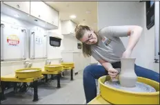  ??  ?? Chrystal O’Boyle, wheel mobile specialist, spins a vase on the Community Creative Center’s Wheel Mobile Traveling Art Studio at the Walton Arts Center Nadine Baum Studios in Fayettevil­le.
(NWA Democrat-Gazette/David Gottschalk)