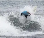  ??  ?? A surfer takes advantage of the waves in southern Florida.