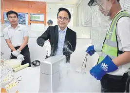  ??  ?? Mr Piyabut demonstrat­ing the chilling process of frozen yogurt at BIG’s facility in Chon Buri.